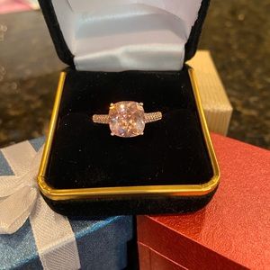 Pink CZ ring. Band is Rose Gold over. Size 10.